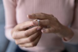 Close,Up,Young,Woman,Taking,Off,Wedding,Ring,,Divorce,Concept,