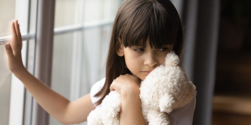 Sad,Lonely,Kid,Holding,,Hugging,Teddy,Bear,Toy,,Standing,At