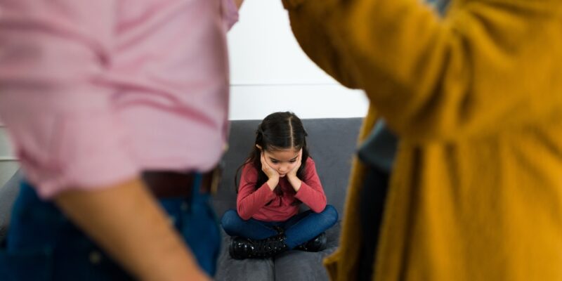 Depressed,Sad,Child,Feeling,In,The,Middle,Of,Her,Parents