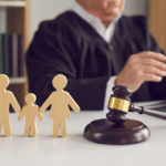 Gavel,,Sound,Block,And,Small,Wooden,Figurines,Of,Husband,,Wife