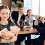 Happy,Little,Girl,Is,Hugging,Teddy,Bear,At,Office,Of