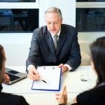 Senior,Businessman,Showing,A,Document