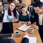 Happy,Red-haired,Mother,With,Little,Daughter,Is,Looking,At,Lawyer