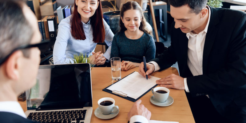 Happy,Red-haired,Mother,With,Little,Daughter,Is,Looking,At,Lawyer