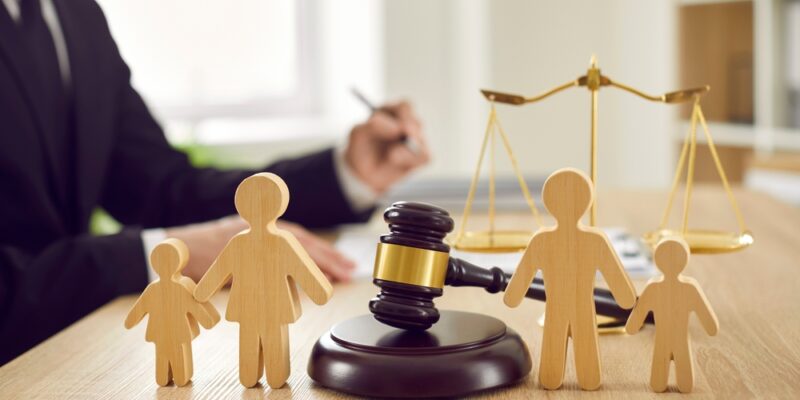 Gavel,,Sound,Block,And,Little,Wooden,Figures,Of,Parents,And