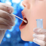 Doctor,Takes,A,Cotton,Bud,From,Childs,Mouth,To,Analyze